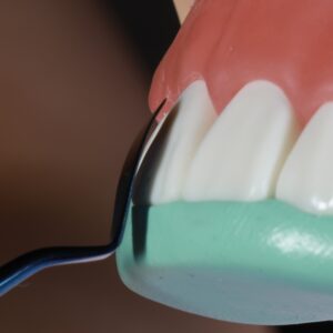 concave dental instrument near teeth showing natural shape of tooth 